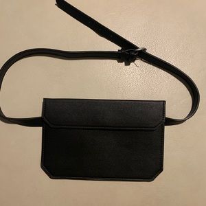 Trendy black flat fanny pack. Never worn.